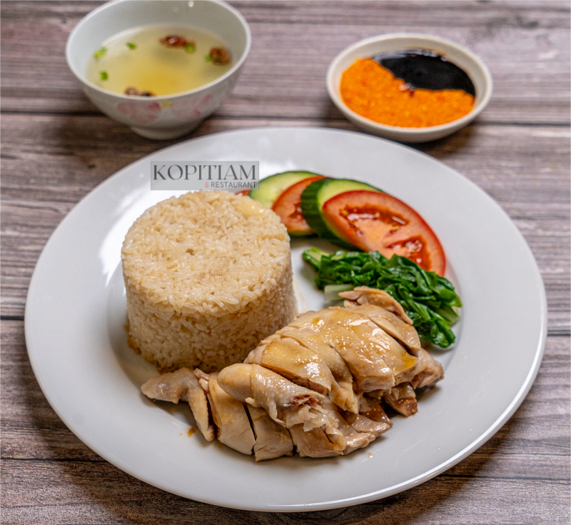 Singapore Hainanese Chicken Rice Hainanese Chicken Rice is Singapore’s national dish, known for its simplicity and rich flavors. The origins of Hainanese Chicken Rice can be traced back to Hainan province in Southern China. The dish was brought to Singapore by immigrants from Hainan who a
